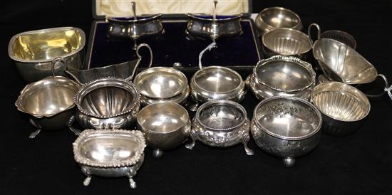 A cased pair of shaped silver salts, with blue glass liners and a quantity of other silver salts, GEORGE III and later, some pairs